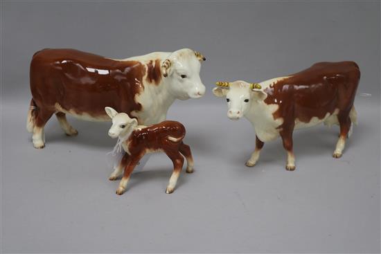 A Beswick early Hereford cattle family comprising bull 949, cow 948 and calf 901B, roan gloss